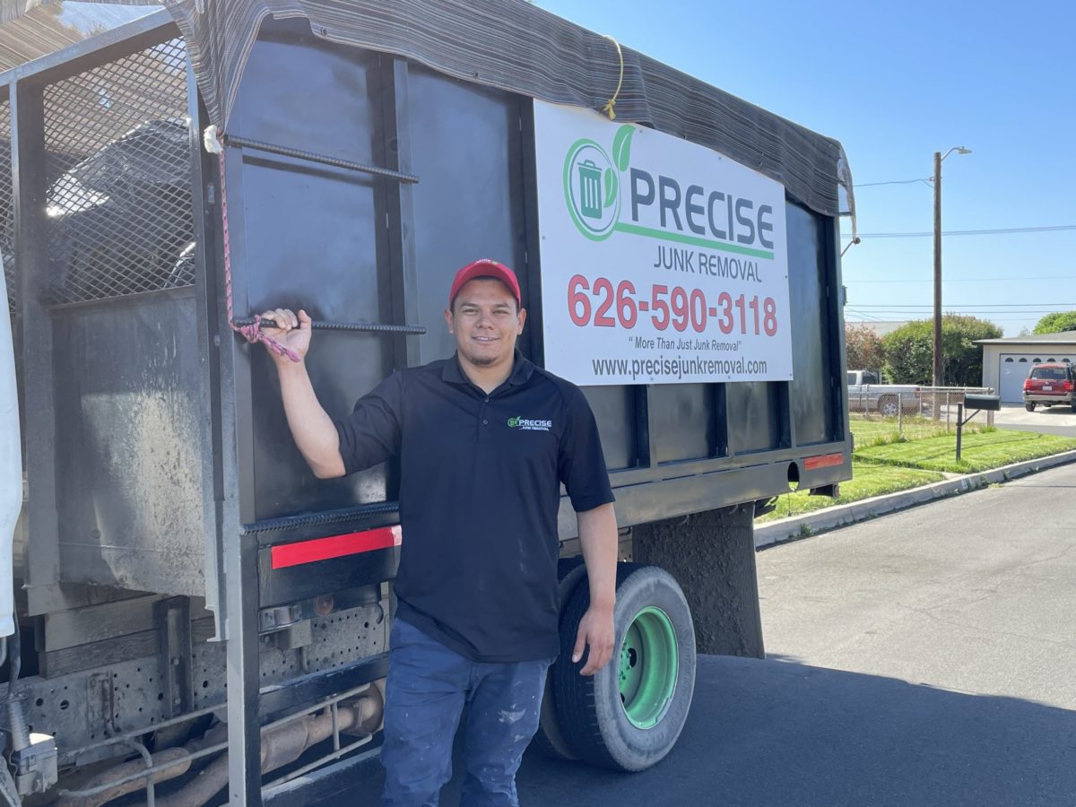 precise junk removal employee ready to get started on renovation services
